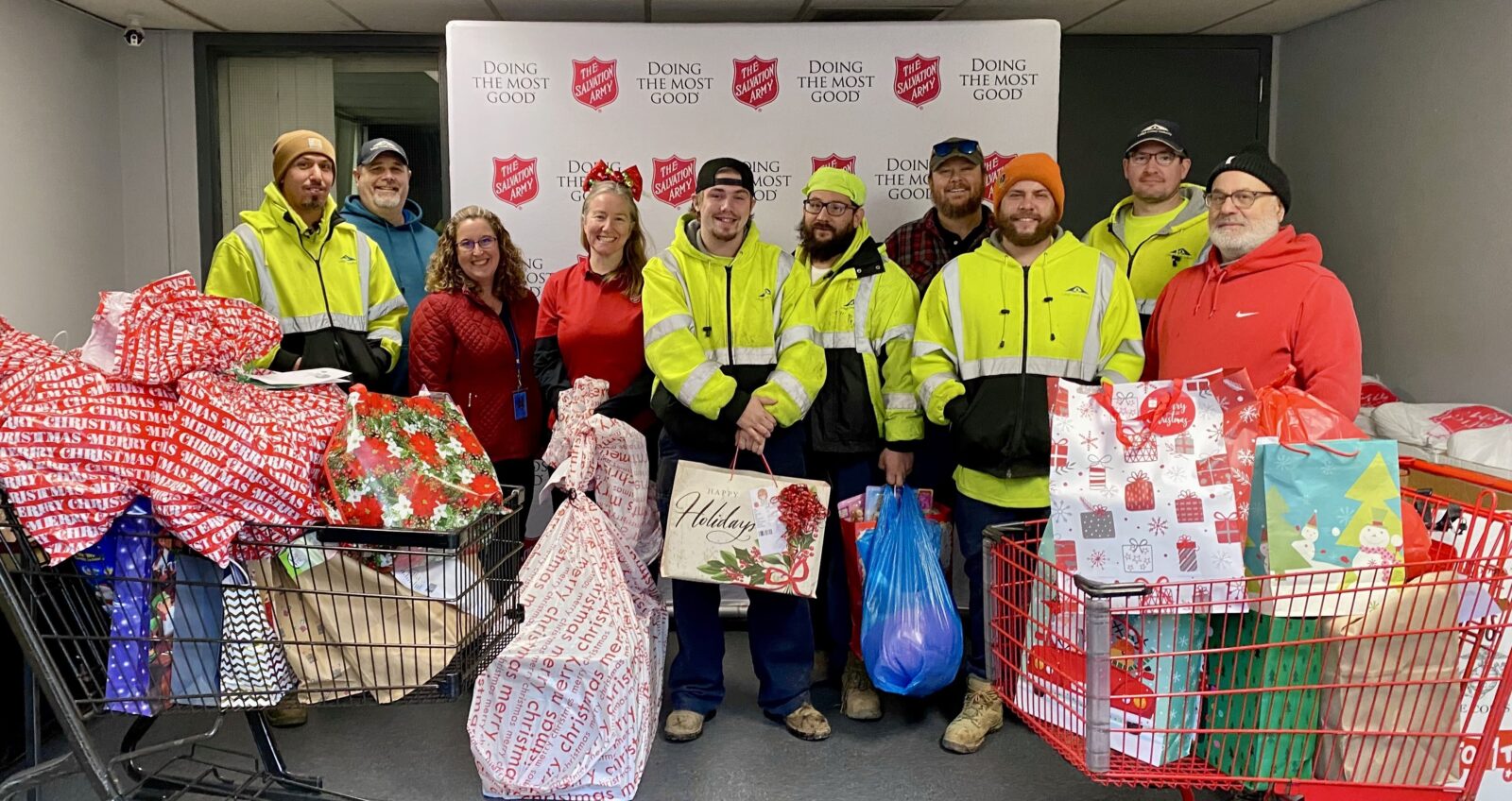 A picture showing LCA employees (left to right) Miguel Ortiz, Chris Bogert, Trissina Trusdell,  Darian Huaman of Salvation Army, Broc Andrew, Robert Sasarak, Pierce Heffner, Ryan Muschlitz, Joseph Luby, Farouk Hamoi to illustrate an LCA blog post on the 2024 Angel Tree donations.
