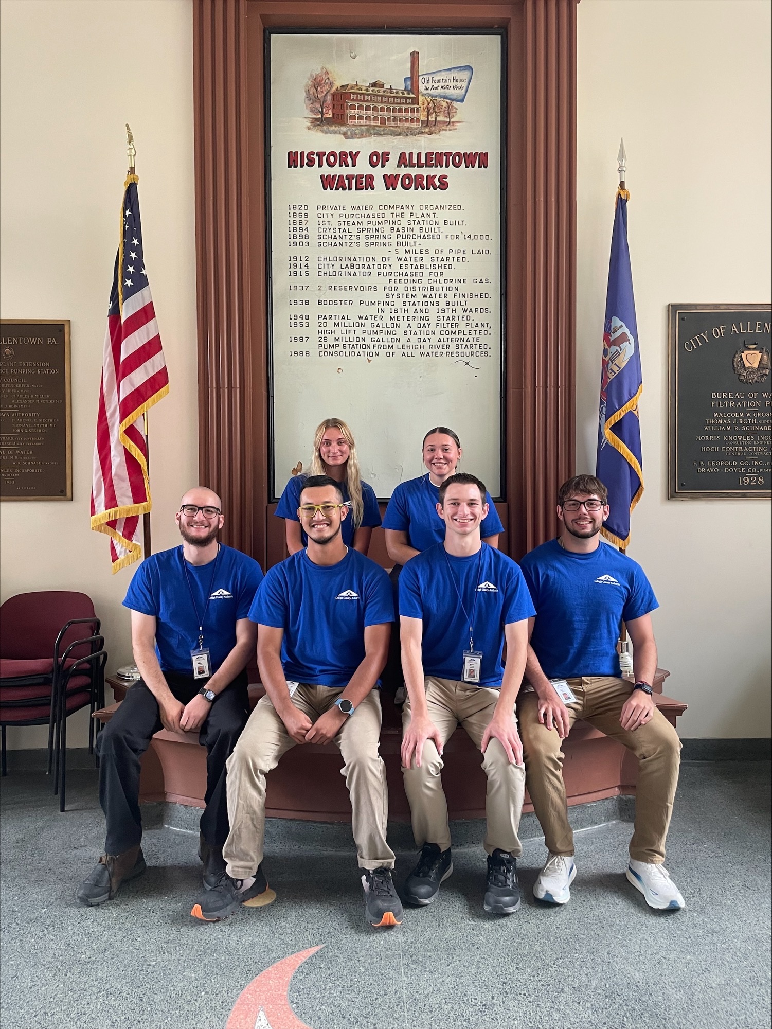 A group of interns in blue LCA shirts pose at the Allentown Water Filtration Plant. The photo illustrates a story on Lehigh County Authority's internship program.